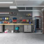 A garage with a lot of work space and shelves