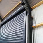 A close up of a garage door with the roller shutter open