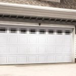 A white garage door with windows on the side.